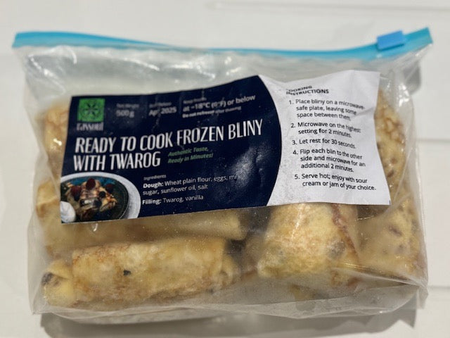 Pack of ready-to-cook frozen Blini with Twarog (sweet cheese-filled crepes) in airtight packaging with cooking instructions. Traditional East-European dessert made with soft crepes and creamy vanilla twarog filling. Order online for a quick and delicious treat.