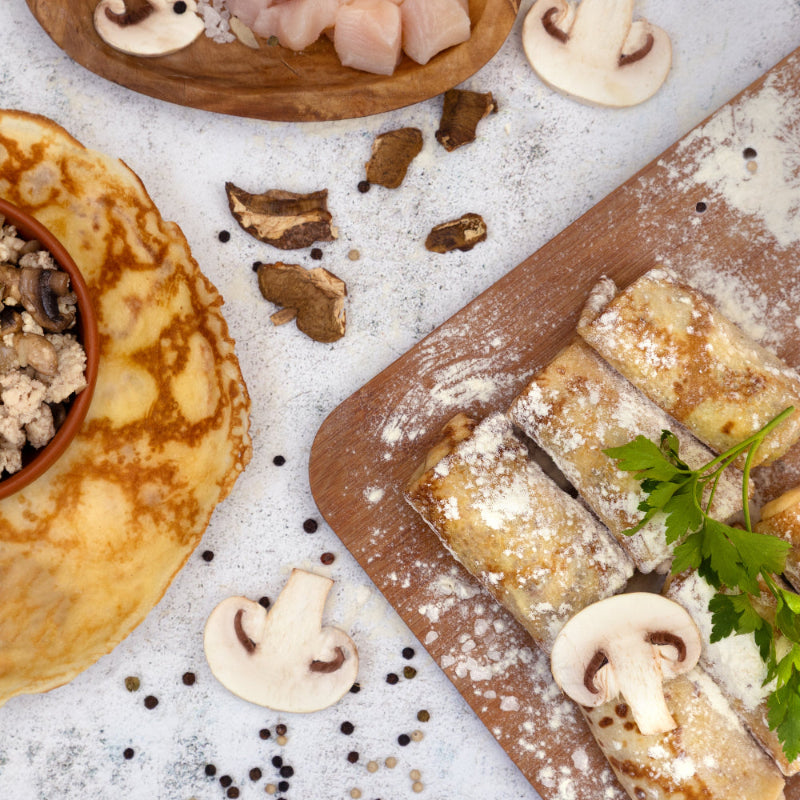 Chicken and mushroom crepes with fresh ingredients – traditional Eastern European frozen food ready to cook.