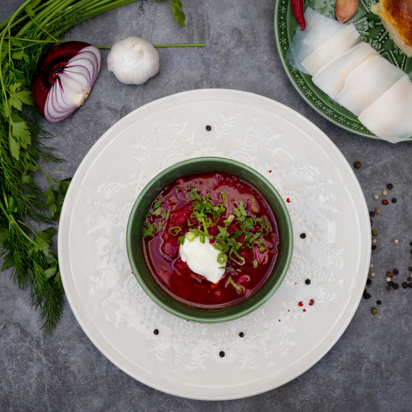 Cooked Borscht beetroot soup with sour cream and herbs, served in a bowl – traditional Eastern European dish by Rassoul, freshly frozen and easy to prepare