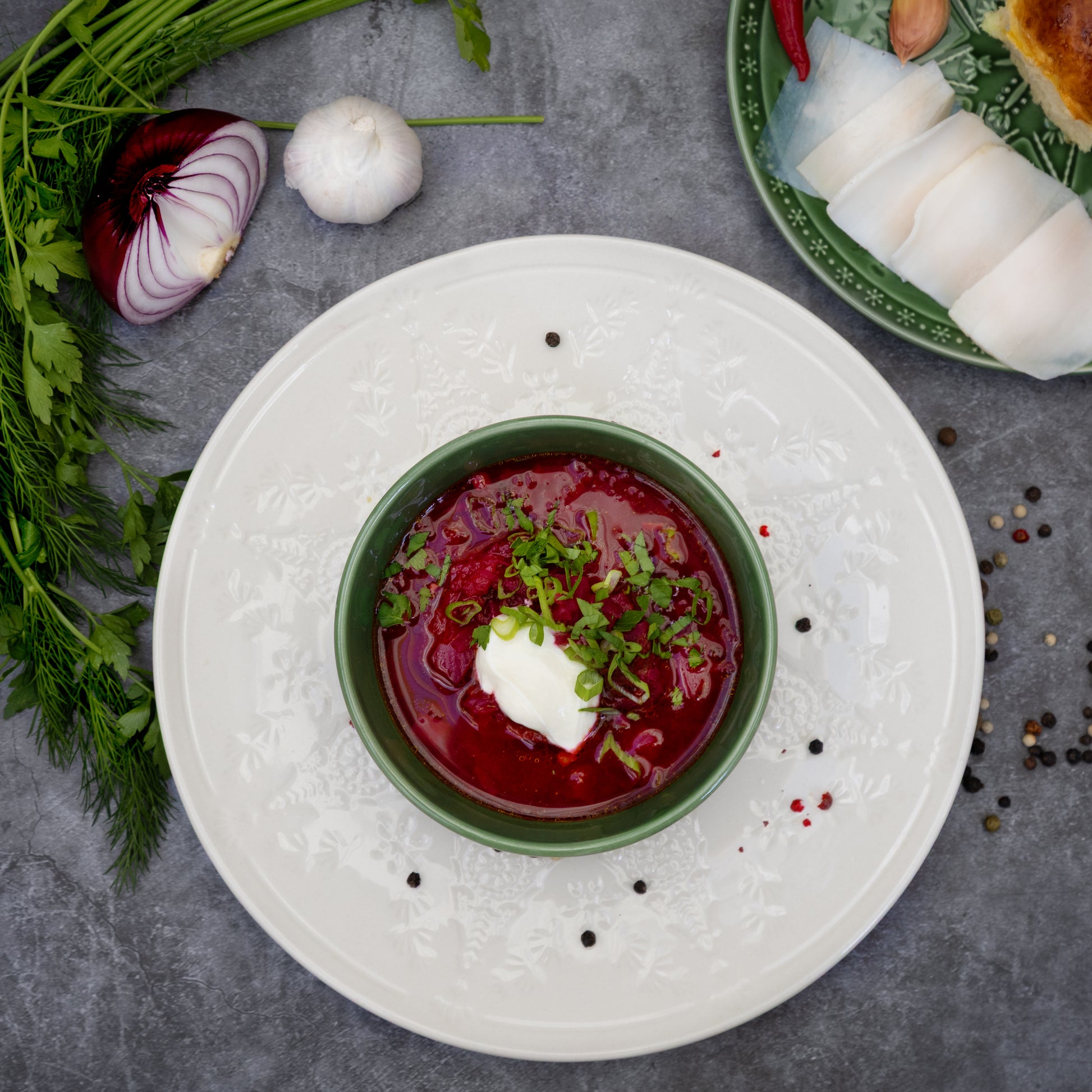 Cooked Borscht beetroot soup with sour cream and herbs, served in a bowl – traditional Eastern European dish by Rassoul, freshly frozen and easy to prepare