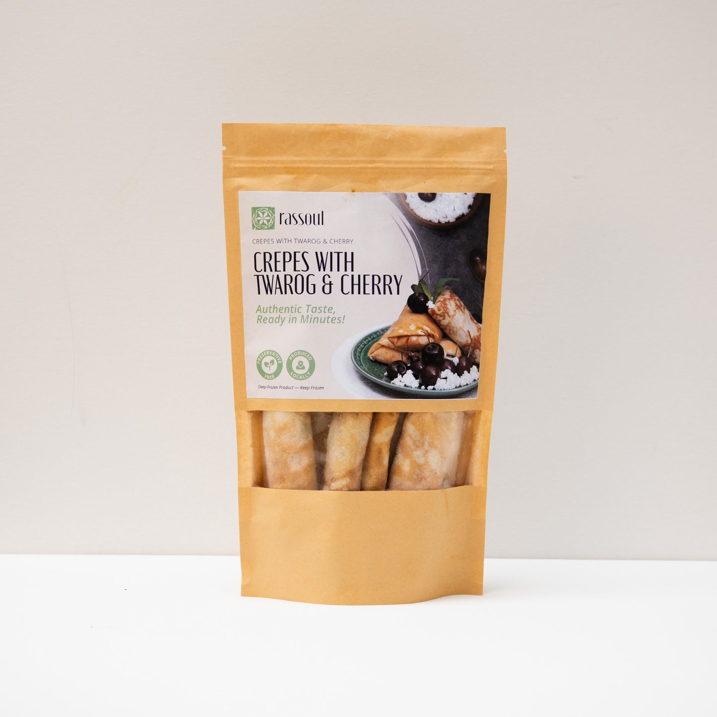 Front of Rassoul Crepes with Twarog & Cherry 500g packaging – frozen Eastern European sweet crepes filled with cheese and cherry.